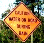 road caution sign - rain wet