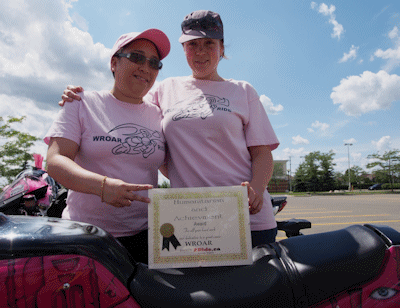 Alex Goldie and Pinky with the award from 2Ride Magazine